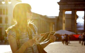 Girl with map at Brandenburger Tor